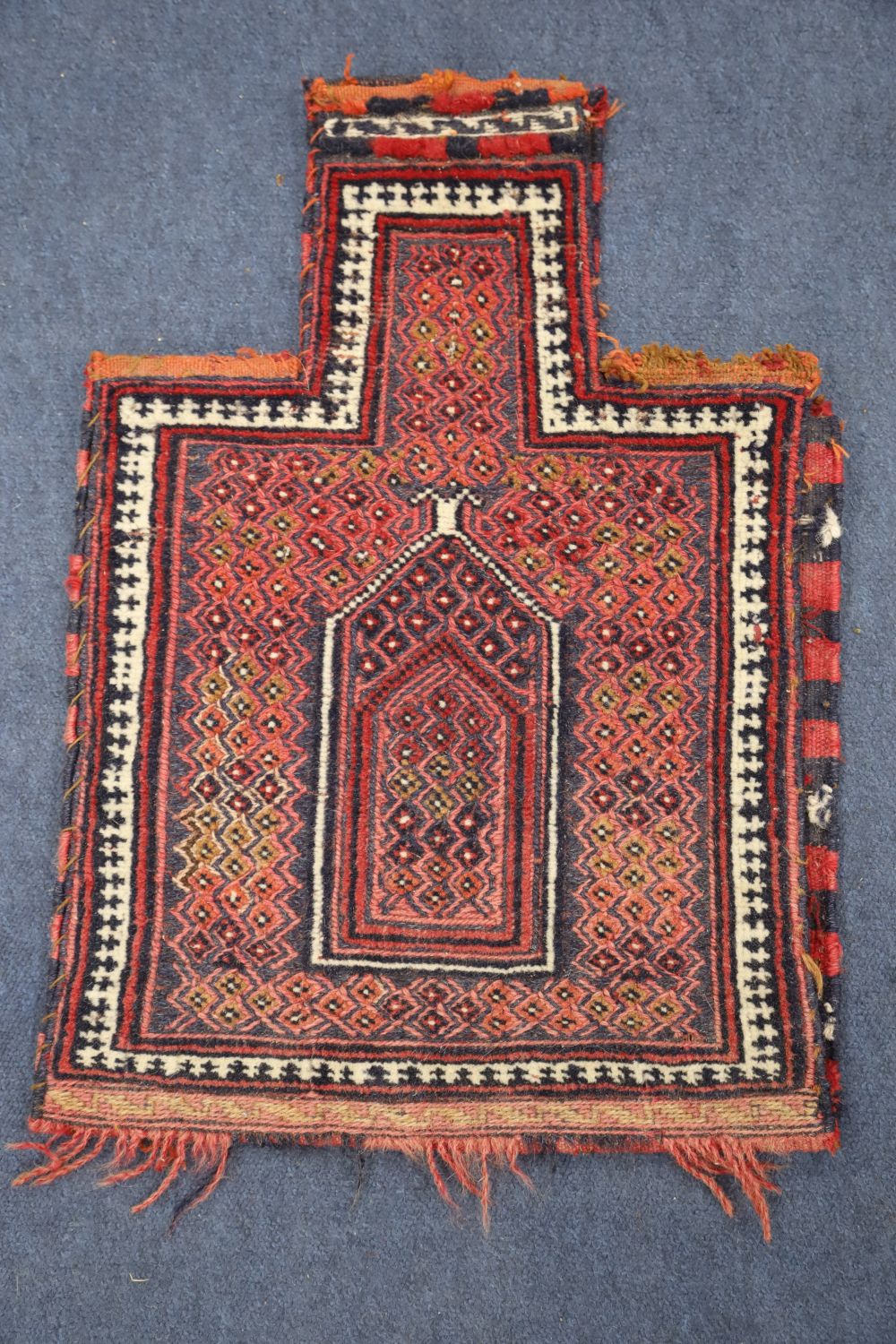 Two Afghan salt bags, a similar saddle bag and a Caucasian rug (4)